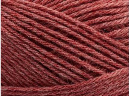 Close-up of red yarn with a textured surface