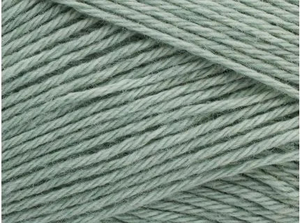 Close-up of light green yarn with a slight texture
