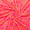 Pink and orange wavy patterned fabric swirled together