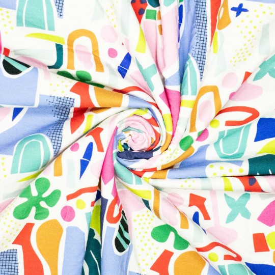Colorful abstract patterned fabric with various shapes and colors.