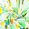 Colorful fabric swatch with abstract patterns in green, yellow, blue, and orange on a white background.