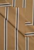 Brown fabric with black and white striped pattern