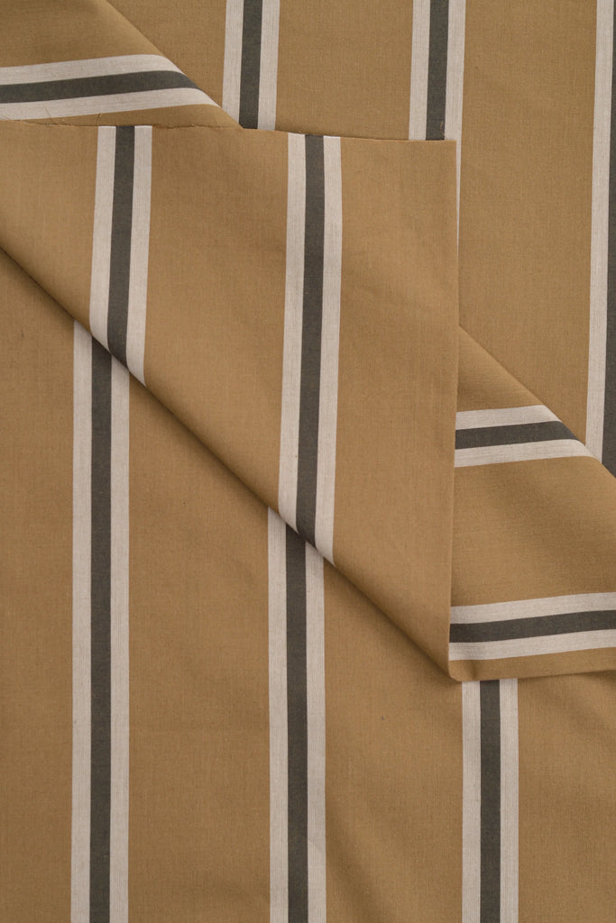 Brown fabric with black and white striped pattern