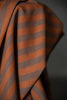 Close-up of brown and orange striped fabric against a dark background