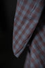 Close-up of a checkered fabric with a dark background