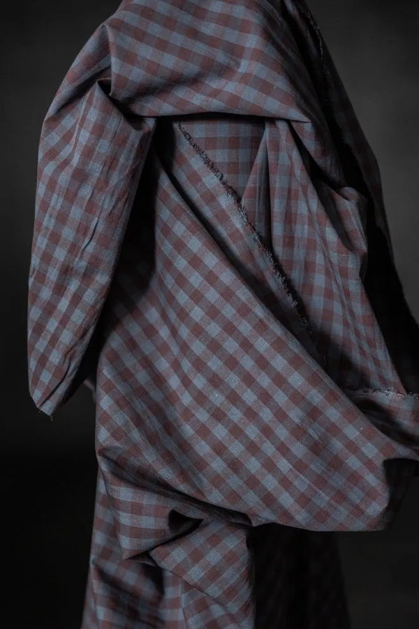 Close-up of a checkered fabric with a dark background