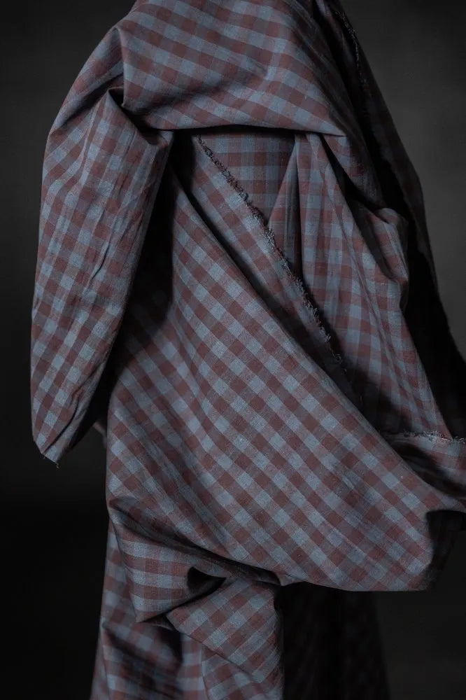 Close-up of a checkered fabric with a dark background