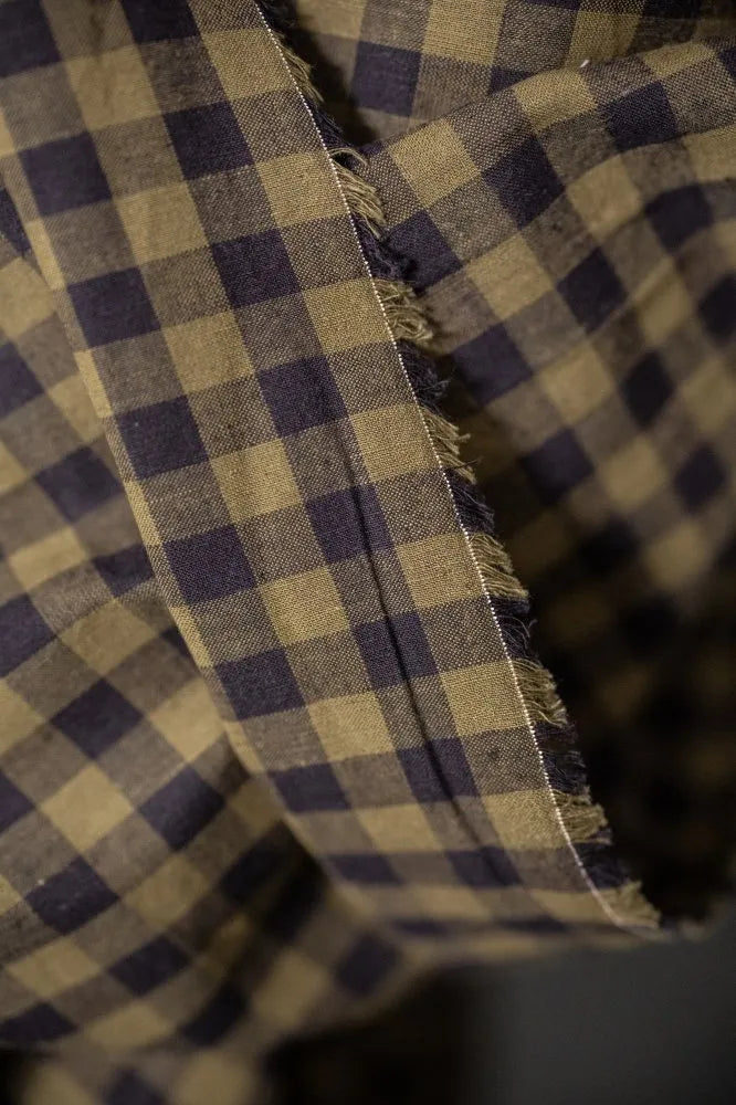 Close-up of a checkered fabric with a frayed edge