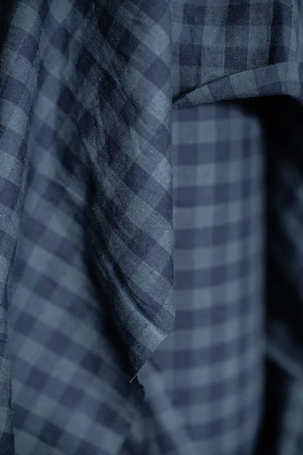 Close-up of a blue and gray checkered fabric texture