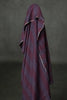 Dark purple towel draped over a dark gray background