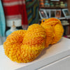 skein of bright orange merino boucle wool