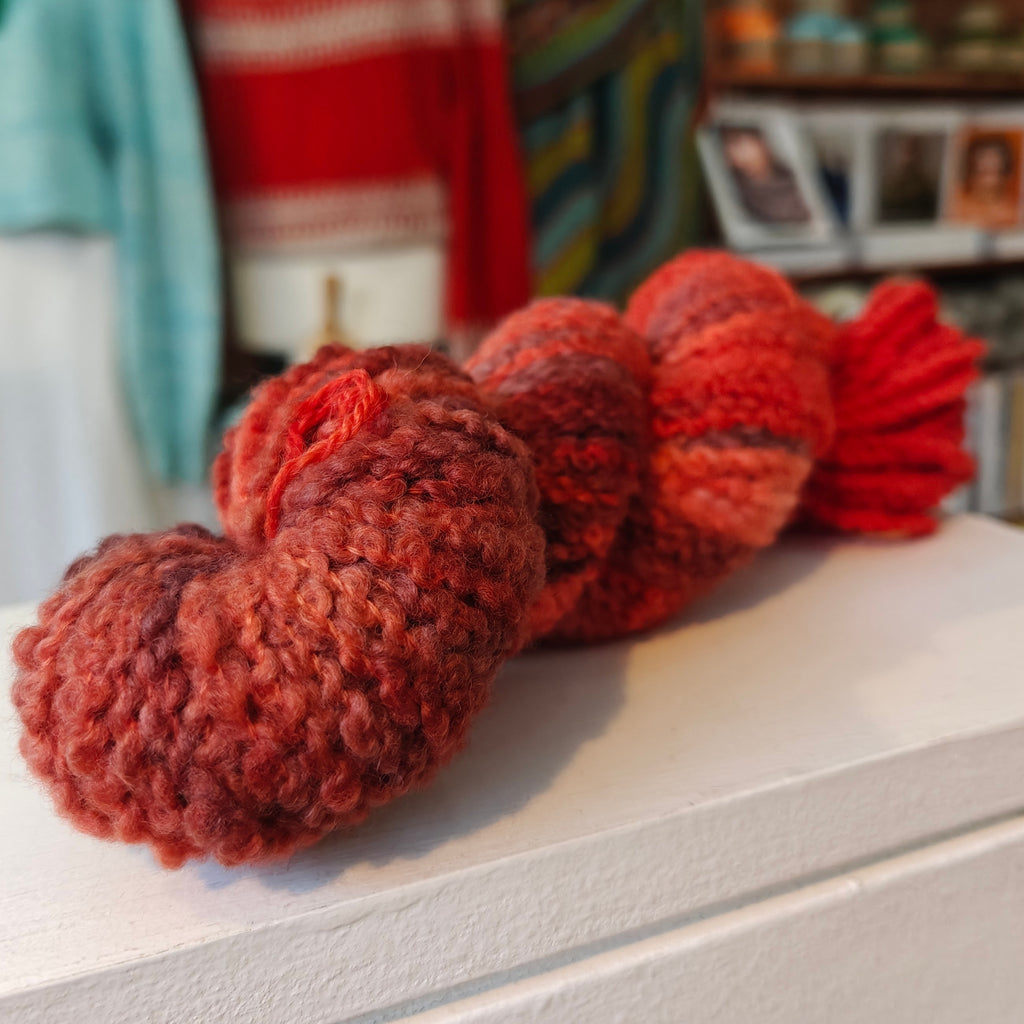 skein of red wool boucle