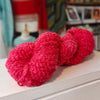 skein of bright red pink wool