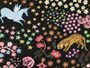 Colorful fabric pattern with unicorns, leopards, and flowers on a black background