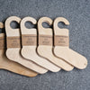a selection of wooden sock blockers