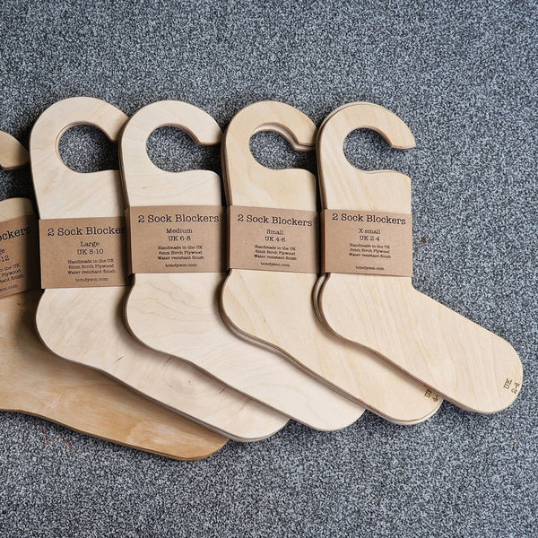 a selection of wooden sock blockers