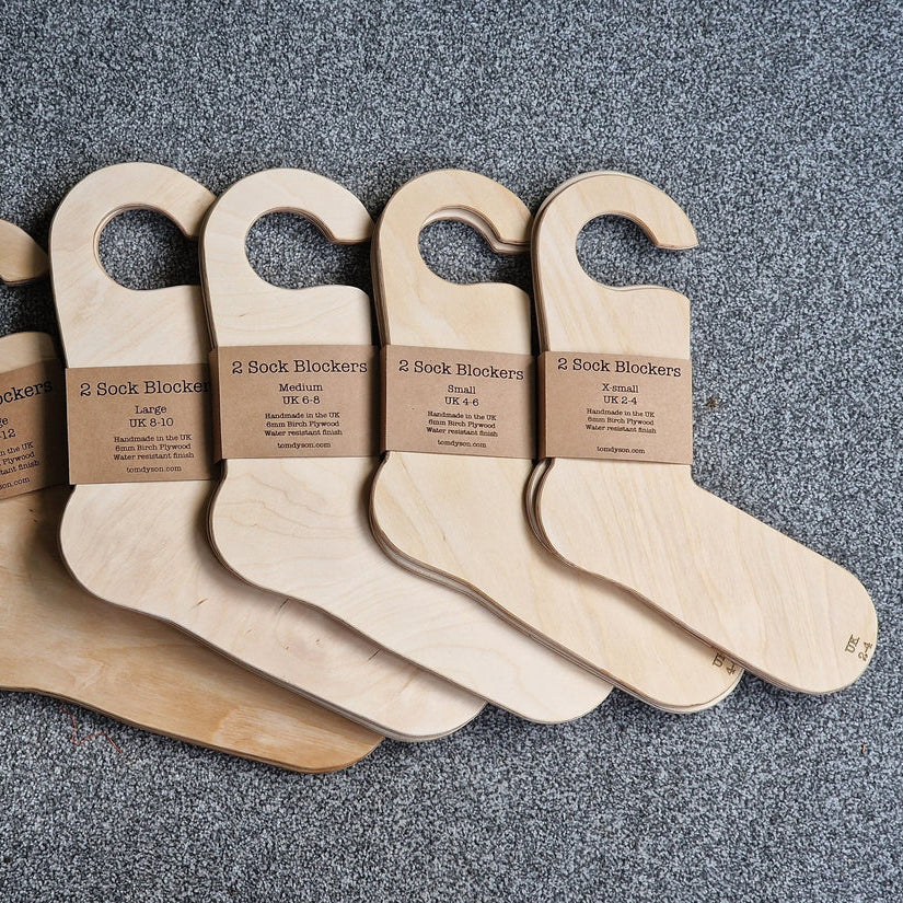 a selection of wooden sock blockers