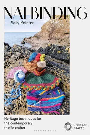 Book cover of 'Nalbinding' by Sally Pointer with colorful knitted items on rocks by the sea.