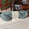 skein of light blue yarn on a shelf in a shop