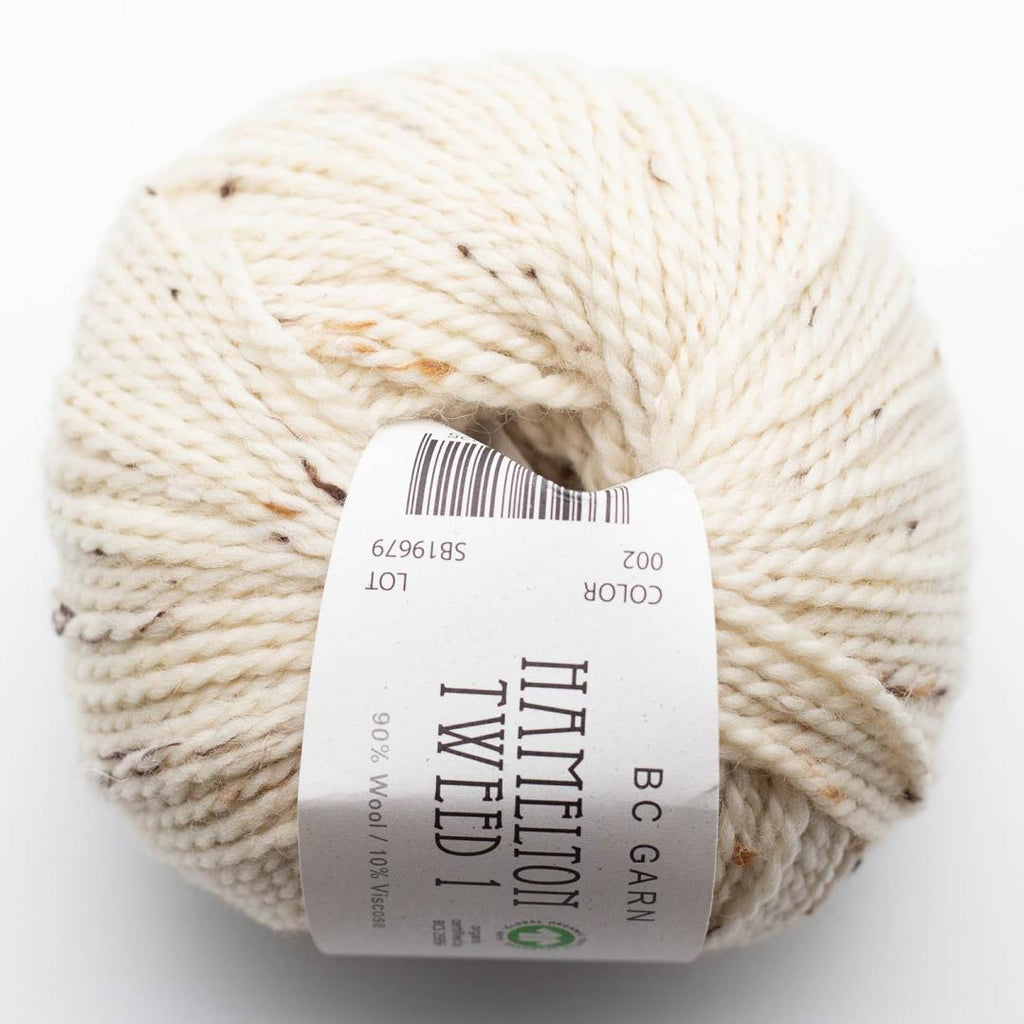 cream ball of wool with label