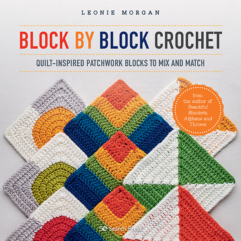 A colorful crochet quilt with various geometric patchwork blocks.