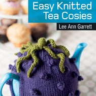 A cover image of a book titled '20 TO KNIT :: EASY KNITTED TEA COSIES' showing a knitted tea cozy in use, fitting over a teapot, with a decorative pattern.