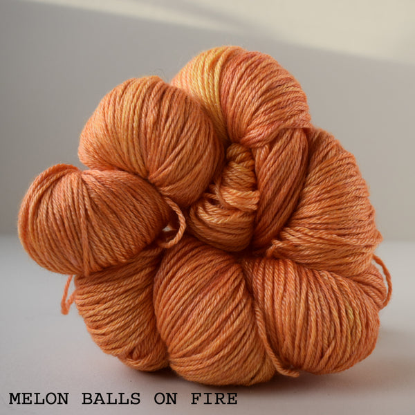 ginger's hand dyed splendor 4ply merino wool and silk soft smooth indie dyed yarn melon balls on fire orange